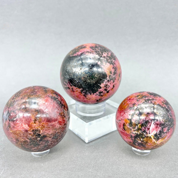 Rhodonite Sphere (1 Kg) (2 to 2.75 in)Crystal River Gems